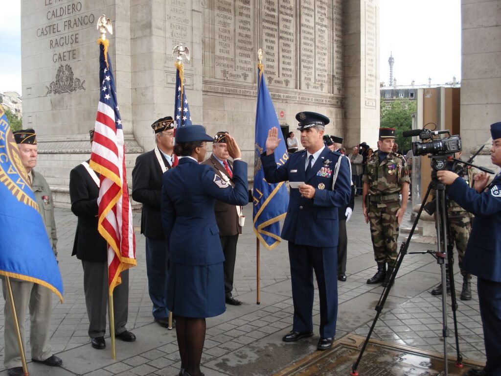 Reenlistment ceremony beneath the Arc de Triomphe in Paris, with me taking the oath in Air Force dress blues.
